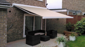 Retractable patio awning shading a domestic garden seating area