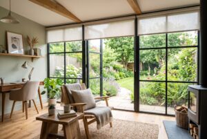 Modern garden room interior with large windows fitted with blinds